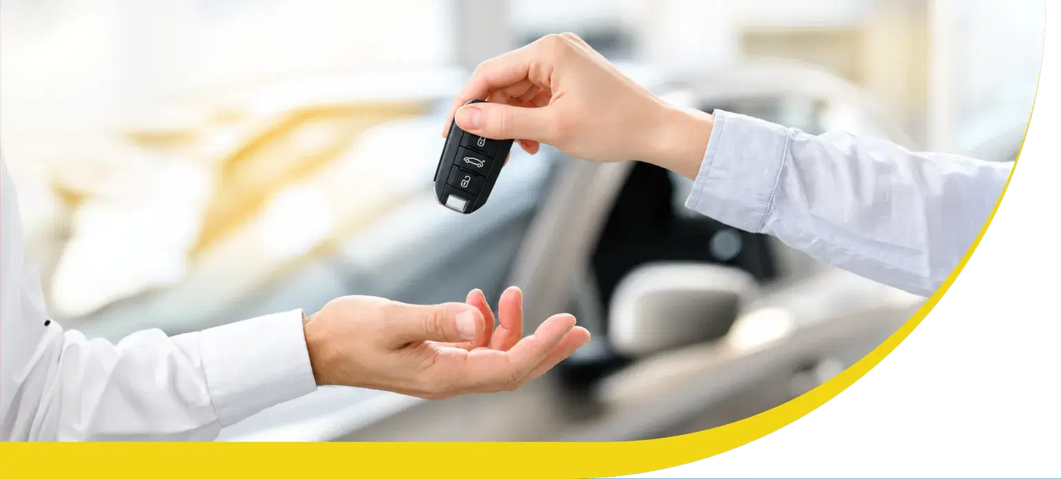 Car keys being handed over to a new owner