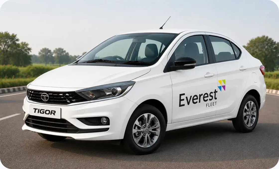 White Everest Fleet Tata Tigor on an open road