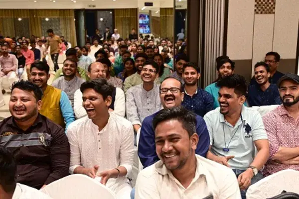Colleagues laughing together at a company celebration