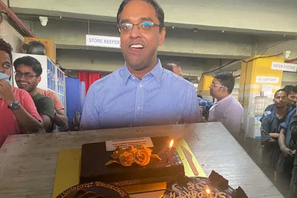 Cutting the cake at an office celebration